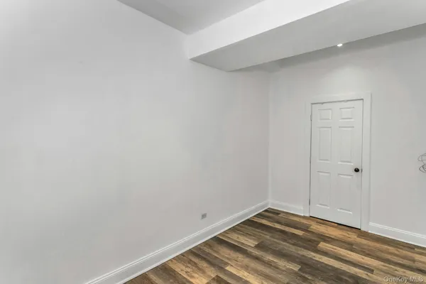 a bathroom with a granite countertop sink a mirror a vanity and a shower