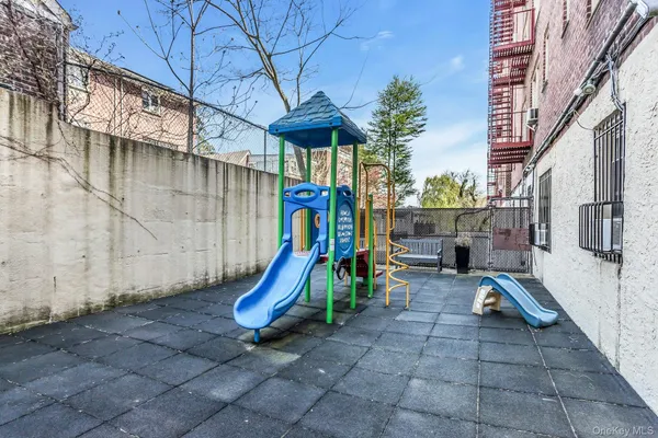 a view of a backyard with sitting area