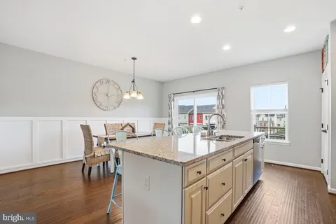 a very nice looking dining room with wooden floor