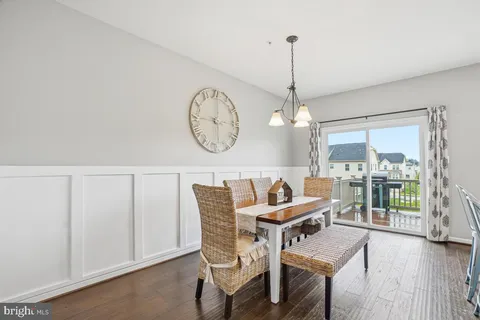 a dining room with furniture window wooden floor