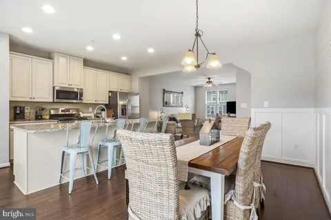 a view of kitchen with cabinets and wooden floor