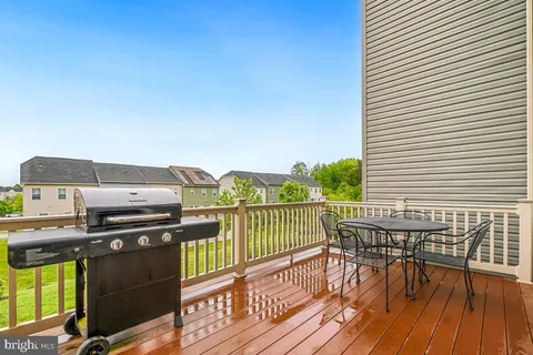 a view of a balcony with furniture