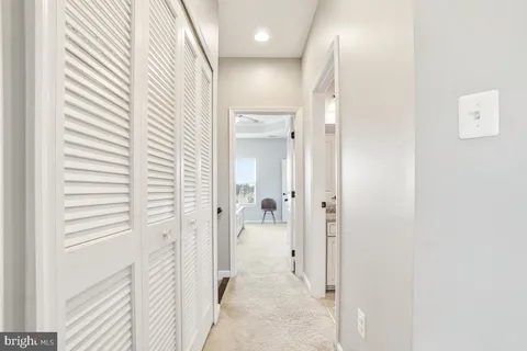 a view of a bathroom from a hallway