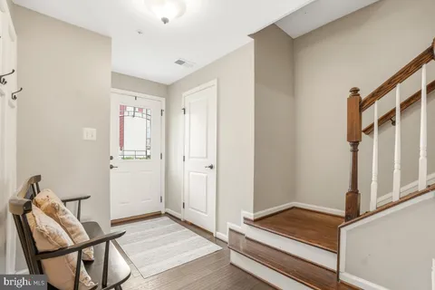 a view of room with furniture and wooden floor