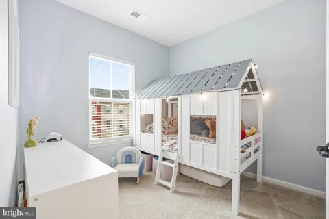 a bedroom with furniture and window