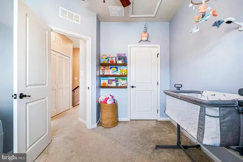 a kitchen with refrigerator and window