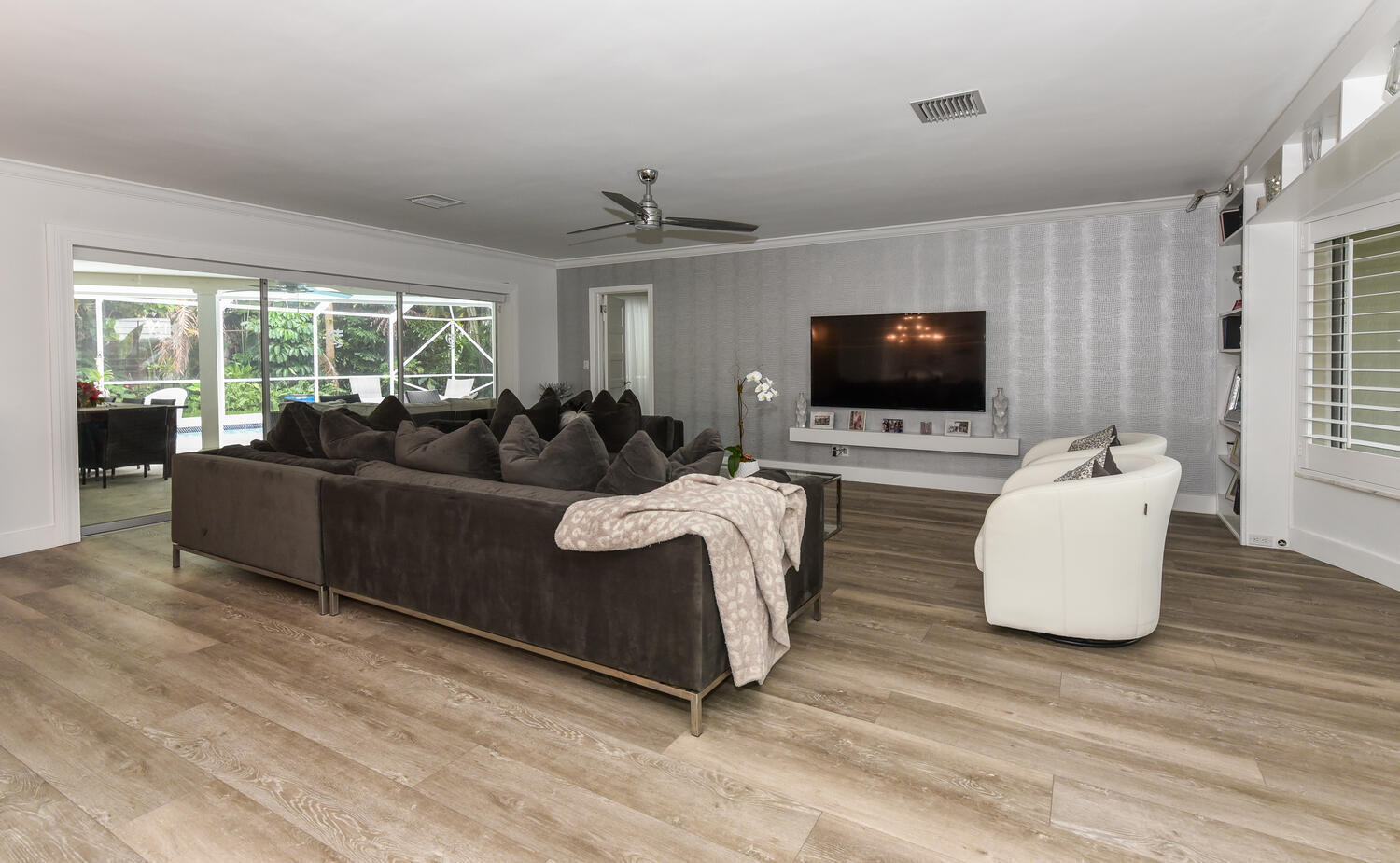 880 Hickory Terrace Boca Raton, FL 33486 - Photo 13 of 38 a living room with furniture and a flat screen tv