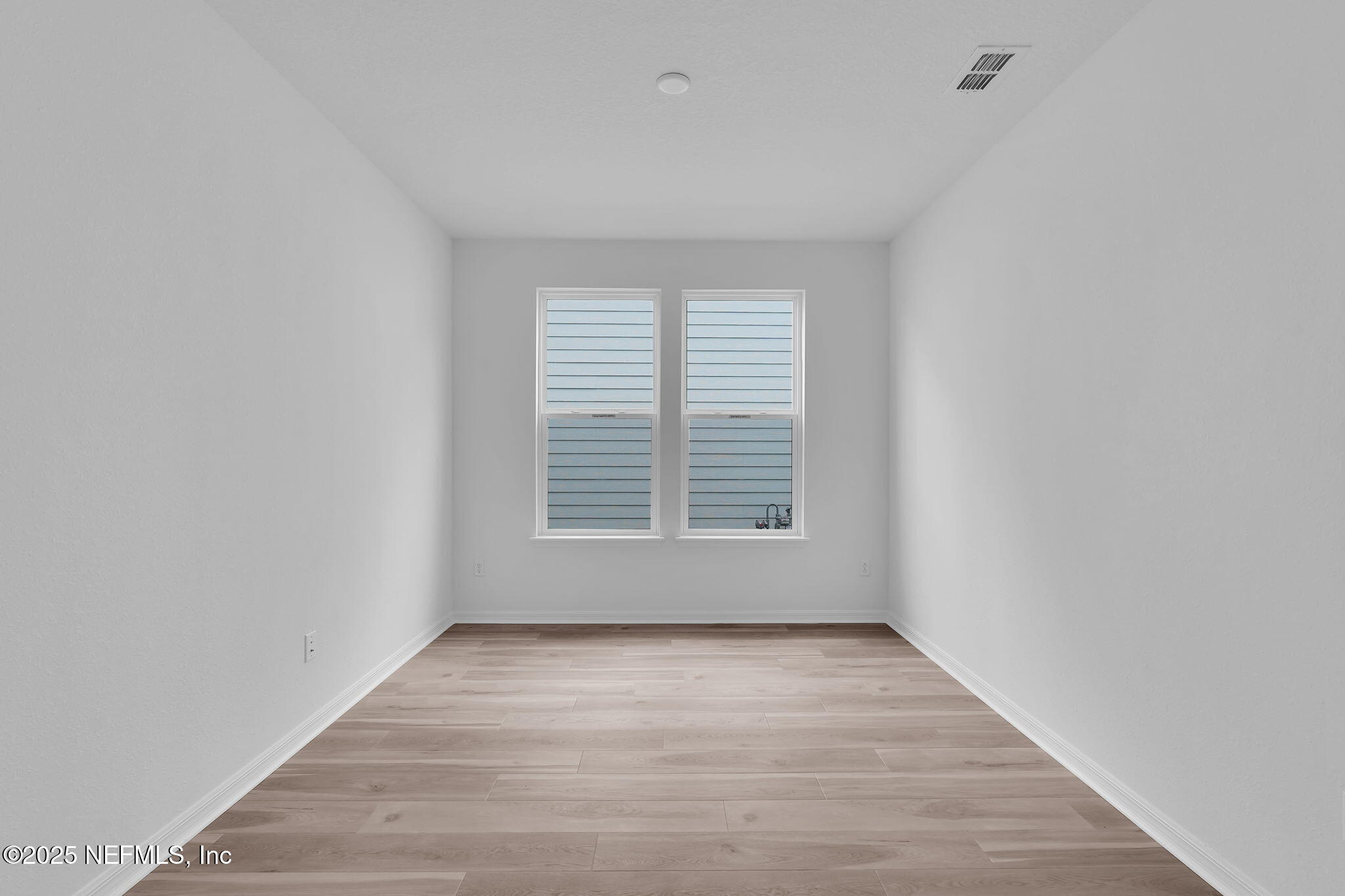 104 Headstream Drive St. Johns, FL 32259 - Photo 17 of 26 a view of an empty room with wooden floor and a window