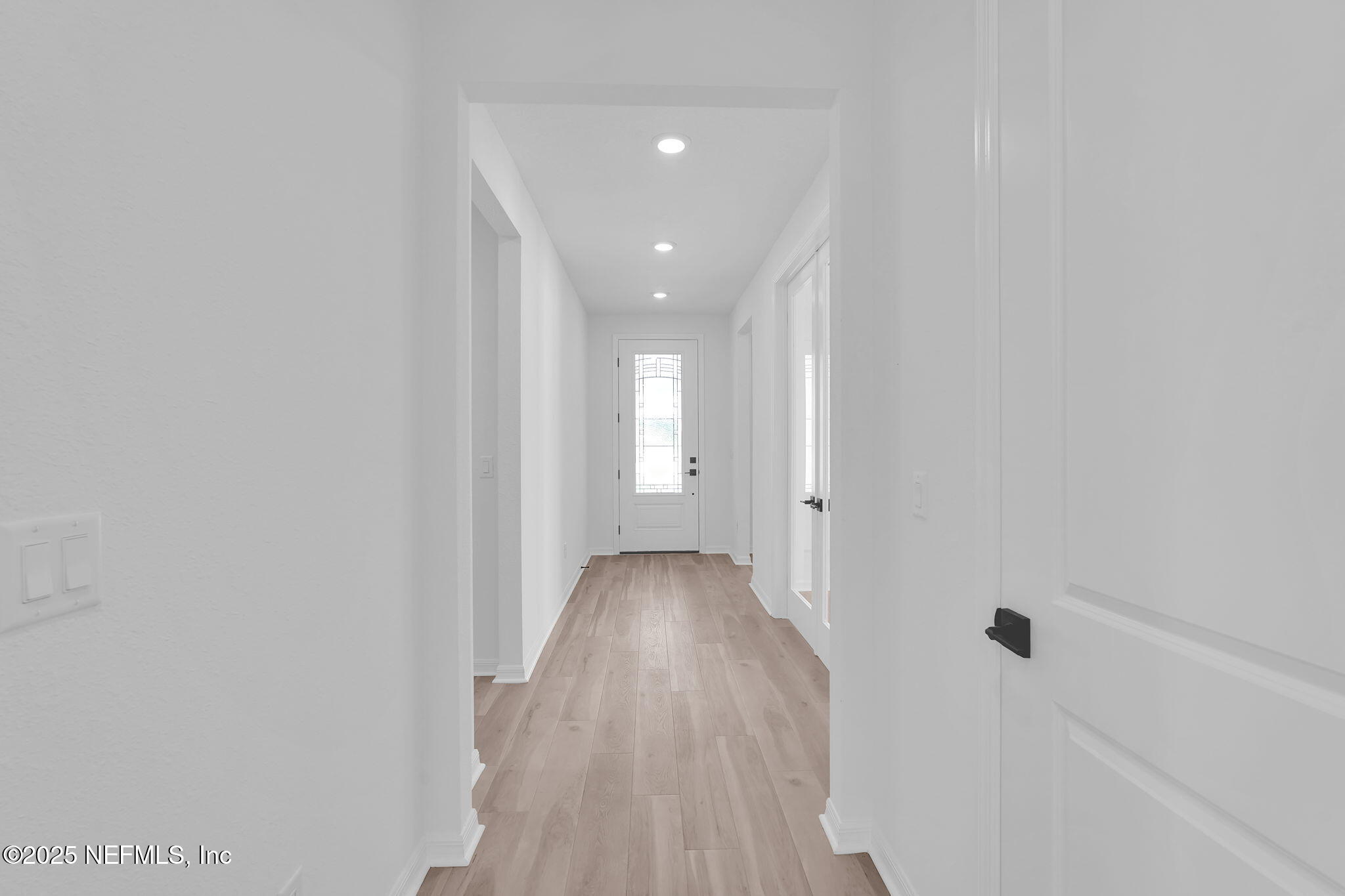 104 Headstream Drive St. Johns, FL 32259 - Photo 3 of 26 a view of a hallway with wooden floor