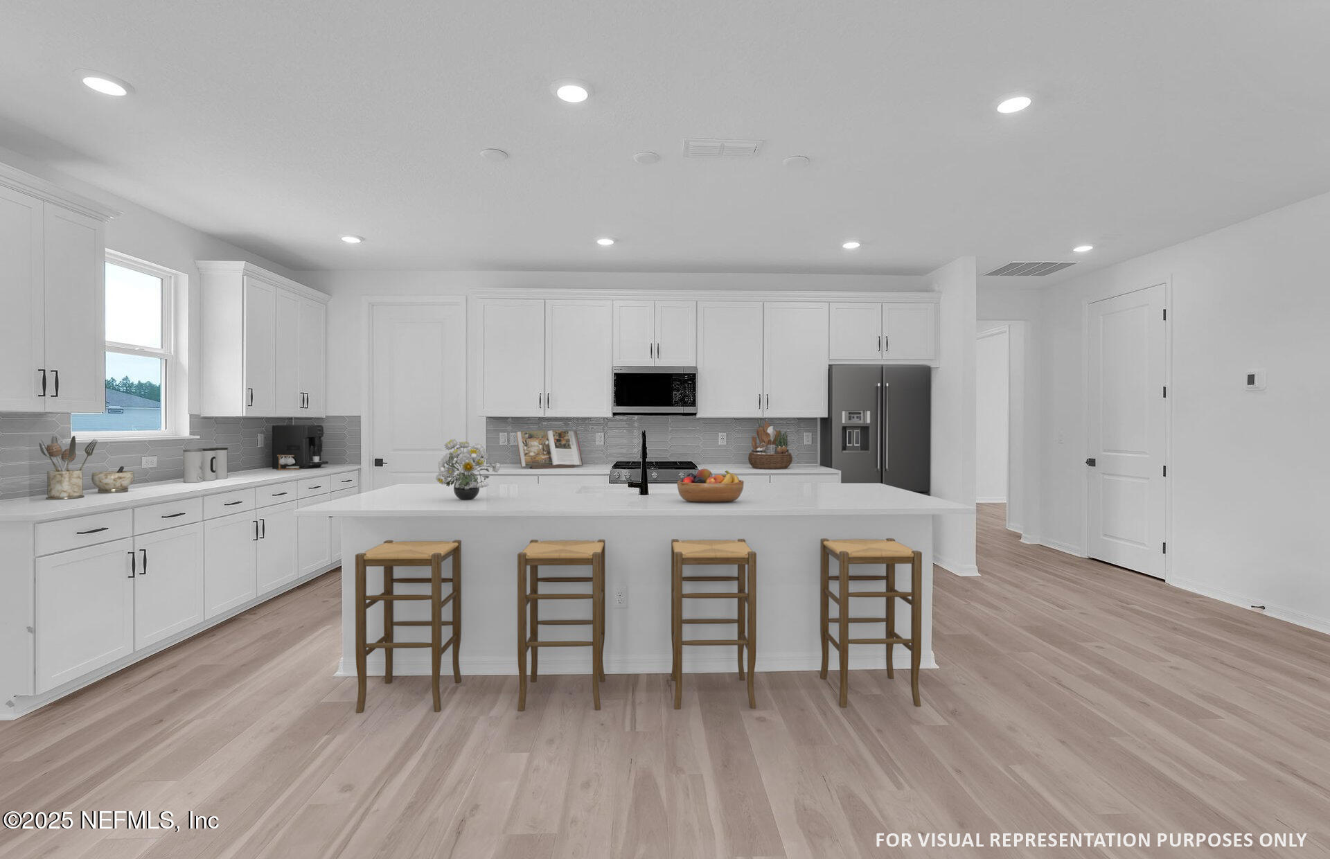 104 Headstream Drive St. Johns, FL 32259 - Photo 5 of 26 a large white kitchen with wooden floor and stainless steel appliances