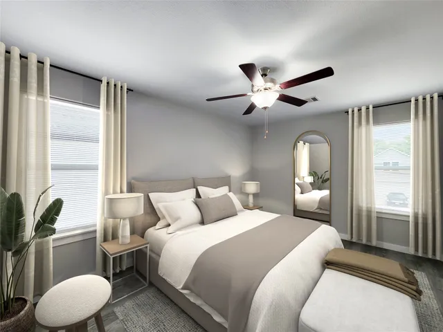 a kitchen with stainless steel appliances a white stove top oven a sink and dishwasher a refrigerator with wooden floor