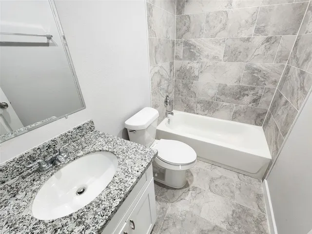 a bedroom with a large bed and a large window