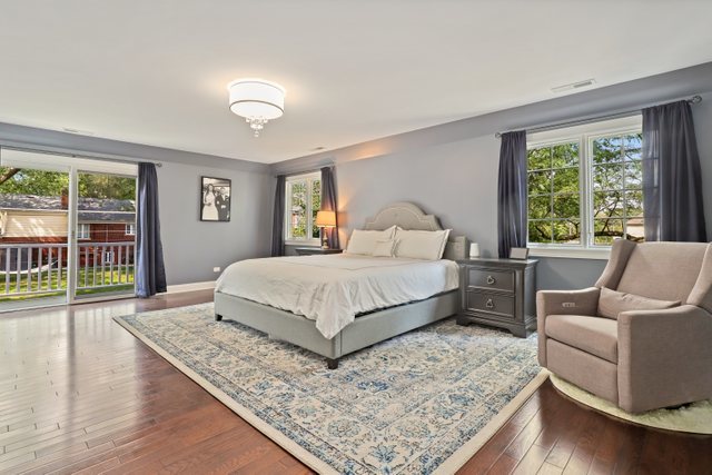 1032 South Spring Avenue La Grange, IL 60525 - Photo 17 of 44 a bedroom with a large bed and a couch