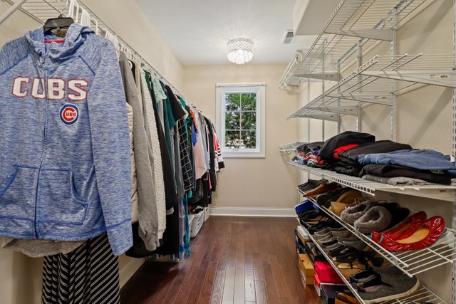 1032 South Spring Avenue La Grange, IL 60525 - Photo 19 of 44 a view of walk in closet with clothes and shoes
