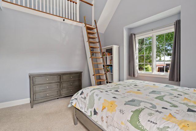 1032 South Spring Avenue La Grange, IL 60525 - Photo 25 of 44 a bedroom with a bed and a window