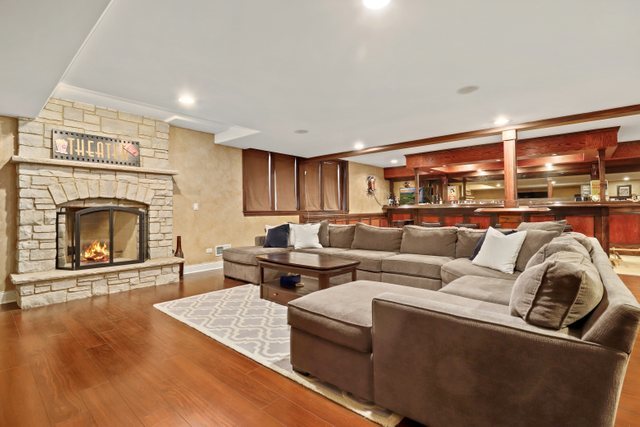 1032 South Spring Avenue La Grange, IL 60525 - Photo 34 of 44 a living room with furniture and a fireplace