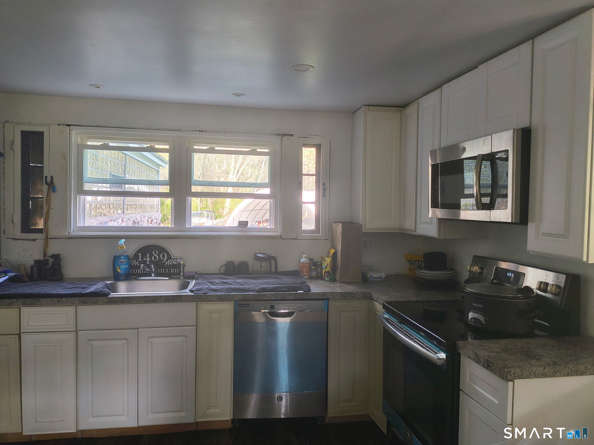 1489 Georges Hill Road Southbury, CT 06488 - Photo 7 of 21 a kitchen with stainless steel appliances granite countertop a sink stove and cabinets