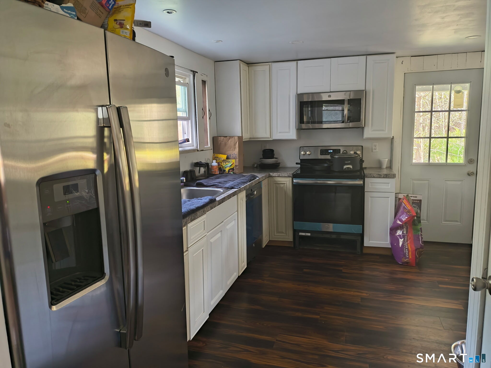 1489 Georges Hill Road Southbury, CT 06488 - Photo 8 of 21 a kitchen with a refrigerator sink and wooden floor
