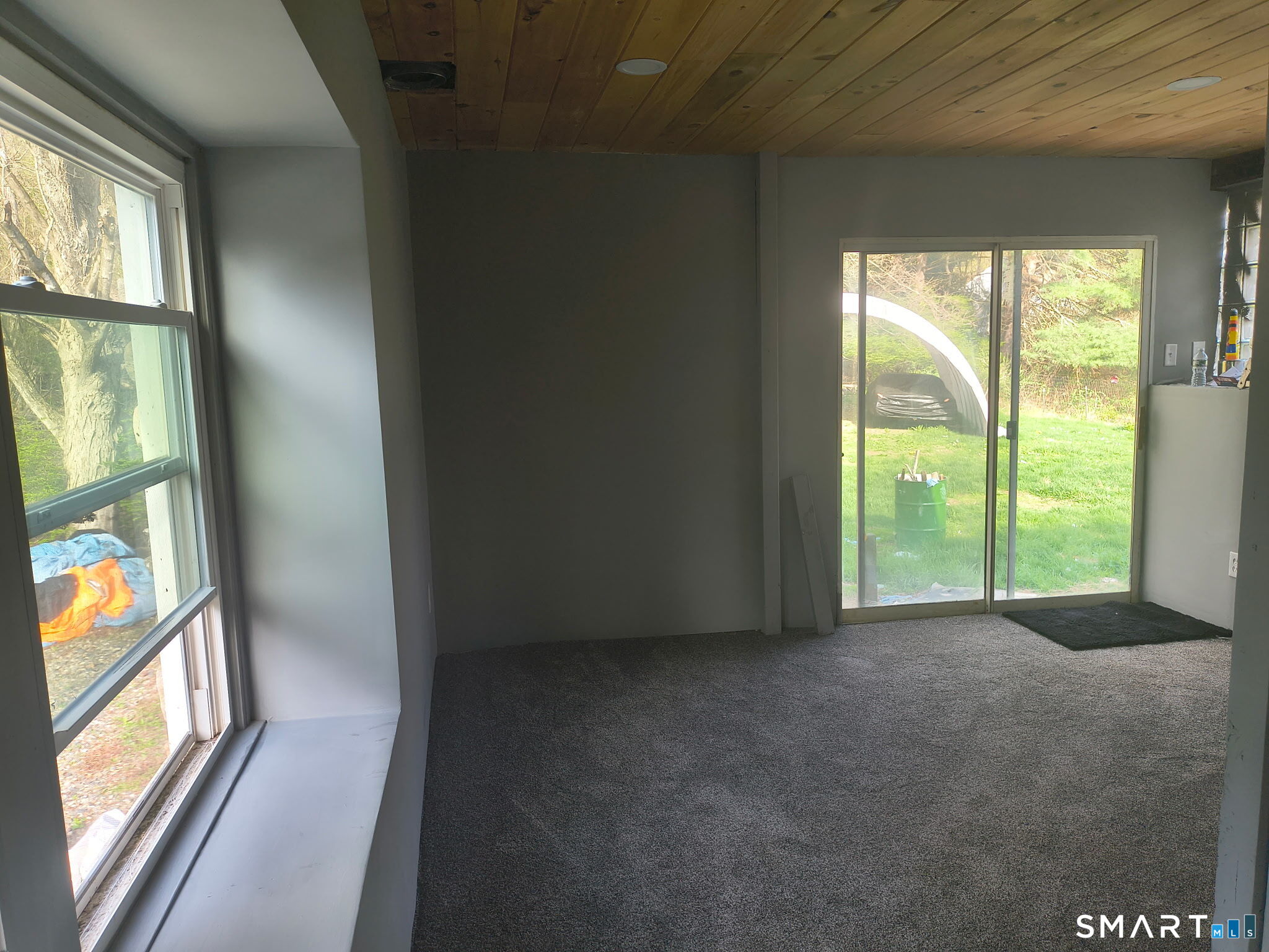 1489 Georges Hill Road Southbury, CT 06488 - Photo 10 of 21 a view of an empty room with wooden floor and a window