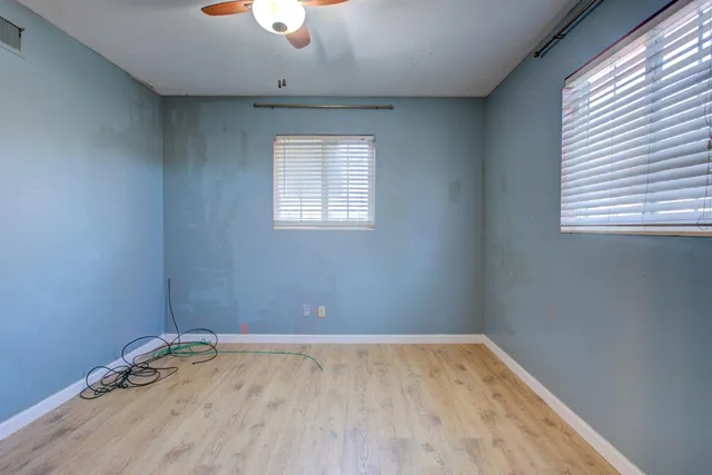 a view of hallway with wooden floor