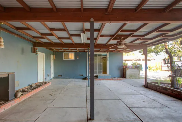 a view of a yard with a house in the background