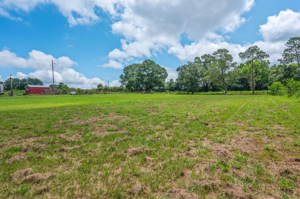 a backyard of a house with lots of green space