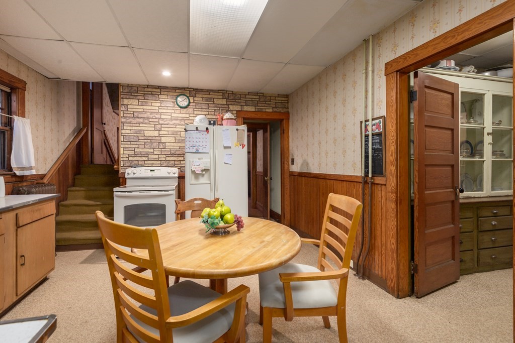 67 Crowninshield Road Brookline, MA 02446 - Photo 11 of 23 a view of a dining room with furniture