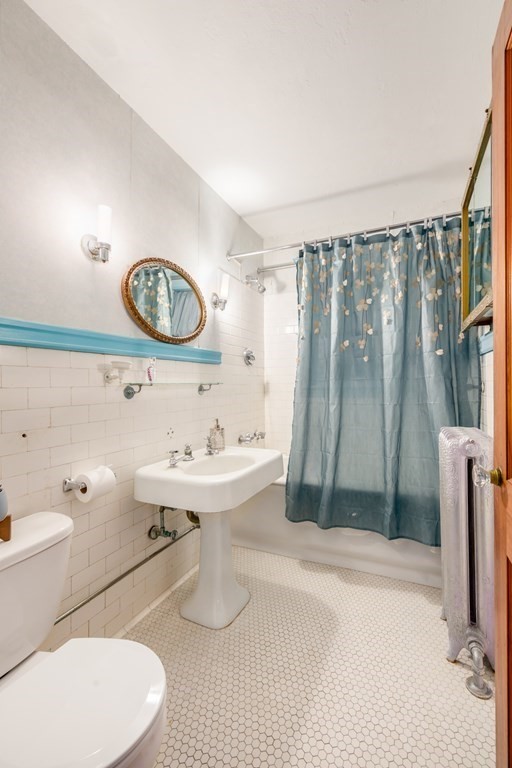 67 Crowninshield Road Brookline, MA 02446 - Photo 17 of 23 a bathroom with a sink toilet and shower