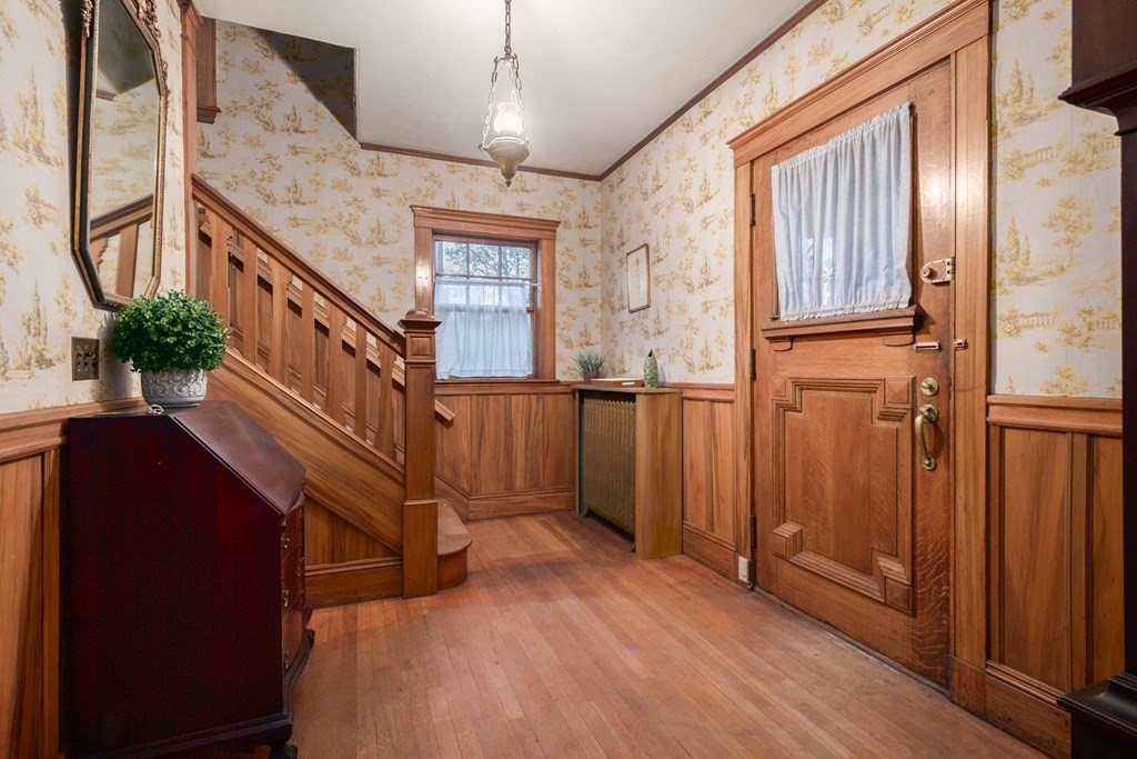 67 Crowninshield Road Brookline, MA 02446 - Photo 2 of 23 a view of entryway with wooden floor and front door