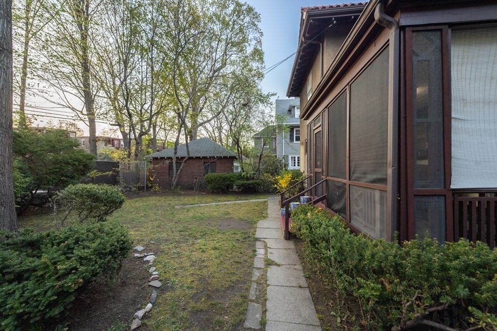 67 Crowninshield Road Brookline, MA 02446 - Photo 21 of 23 a view of a back yard of the house