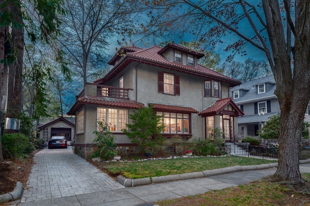 67 Crowninshield Road Brookline, MA 02446 - Photo 22 of 23 a front view of a house with garden