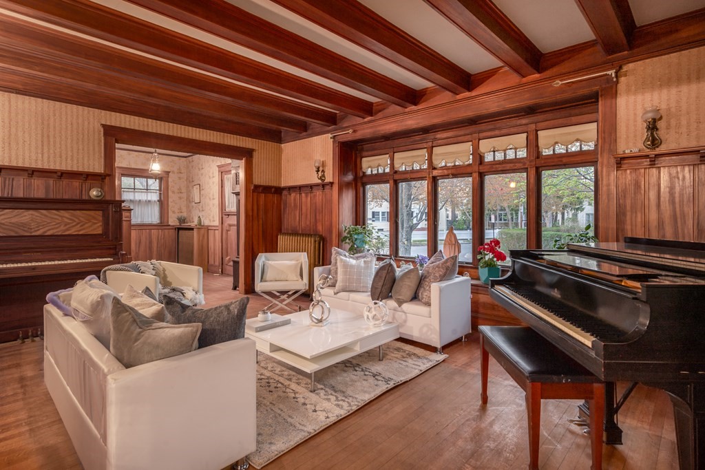 67 Crowninshield Road Brookline, MA 02446 - Photo 5 of 23 a living room with patio furniture and a large window