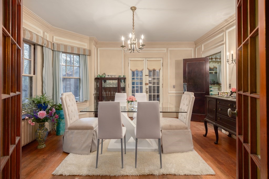 67 Crowninshield Road Brookline, MA 02446 - Photo 6 of 23 a view of a dining room with furniture window and wooden floor