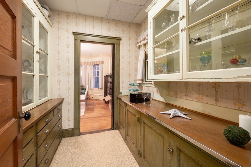 67 Crowninshield Road Brookline, MA 02446 - Photo 7 of 23 a kitchen with a sink and a stove top oven