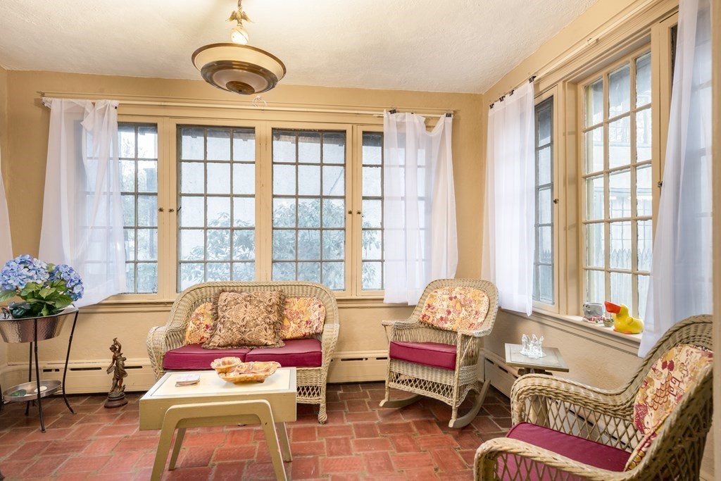 67 Crowninshield Road Brookline, MA 02446 - Photo 9 of 23 a living room with furniture and windows