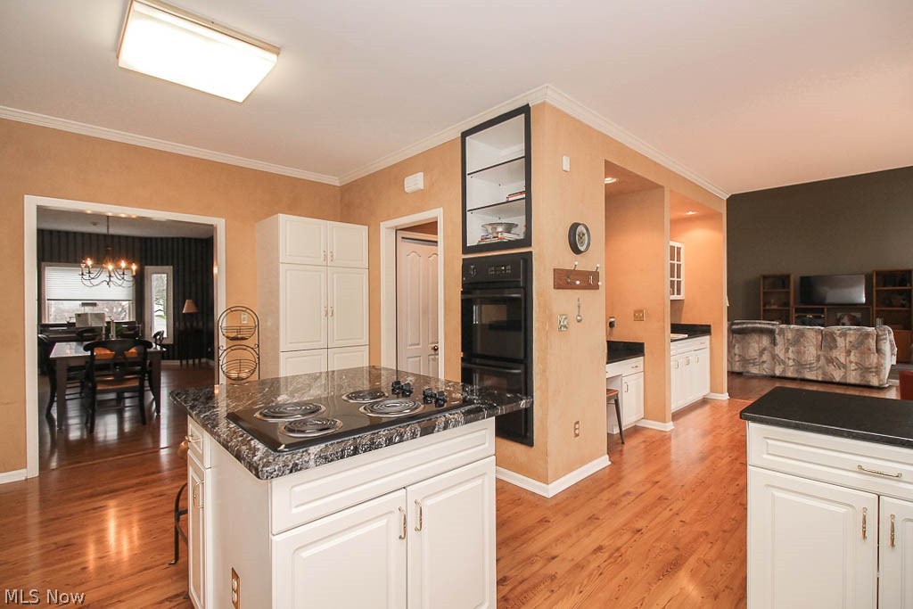 434 Longspur Road Highland Heights, OH 44143 - Photo 5 of 35 Kitchen with a center island, countertop range and wall ovens.