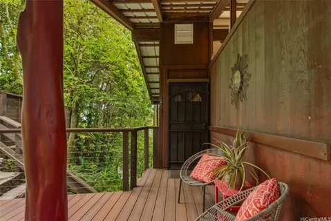a view of balcony with two chairs