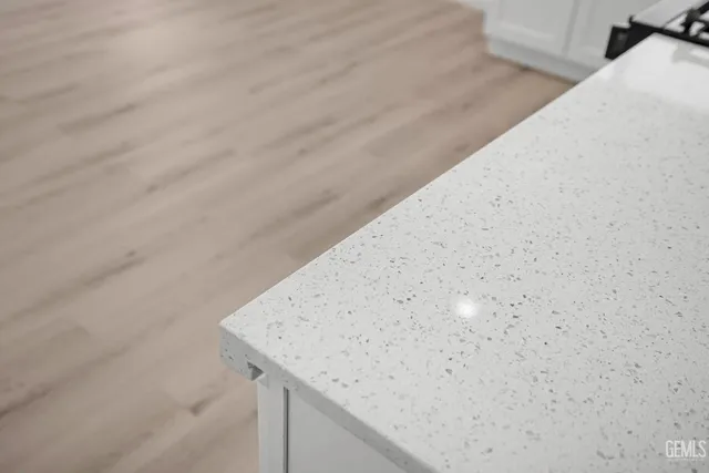 a view of wooden cabinets and floor