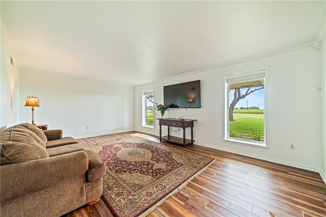 501 South County Road 1140 Riviera, TX 78379 - Photo 5 of 40 Spacious formal living room featuring wood-look fl
