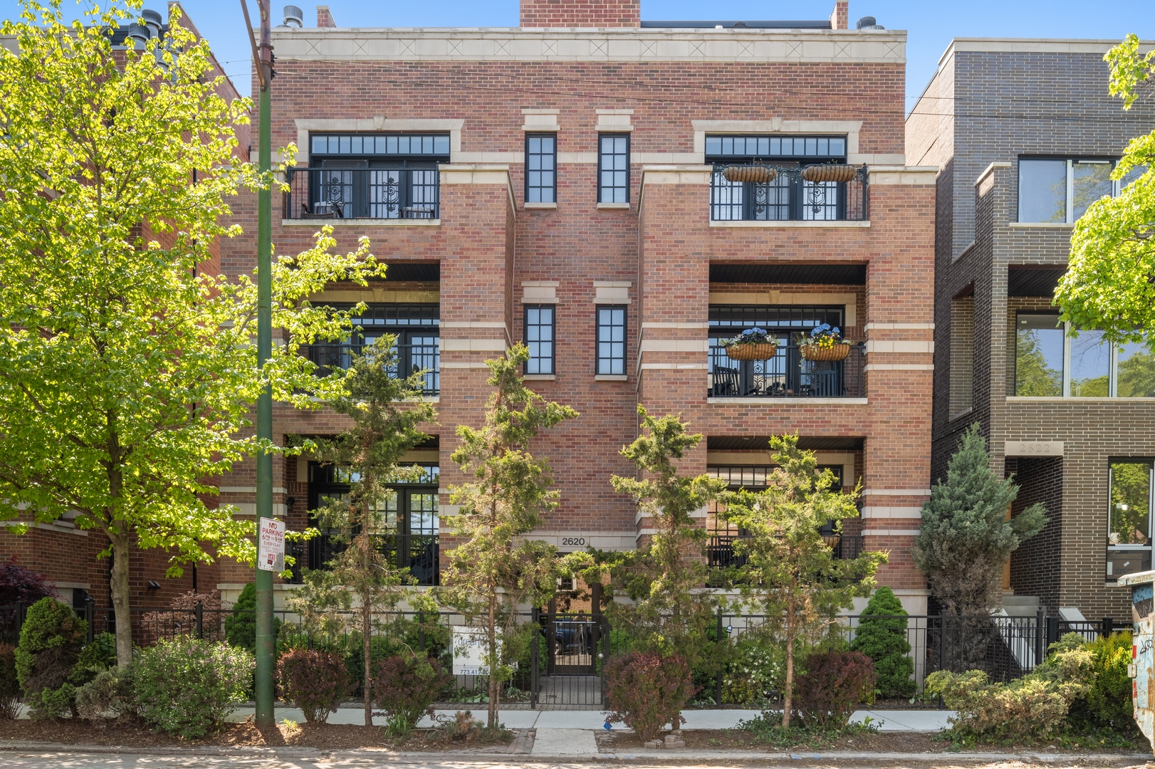 a front view of a building with street view