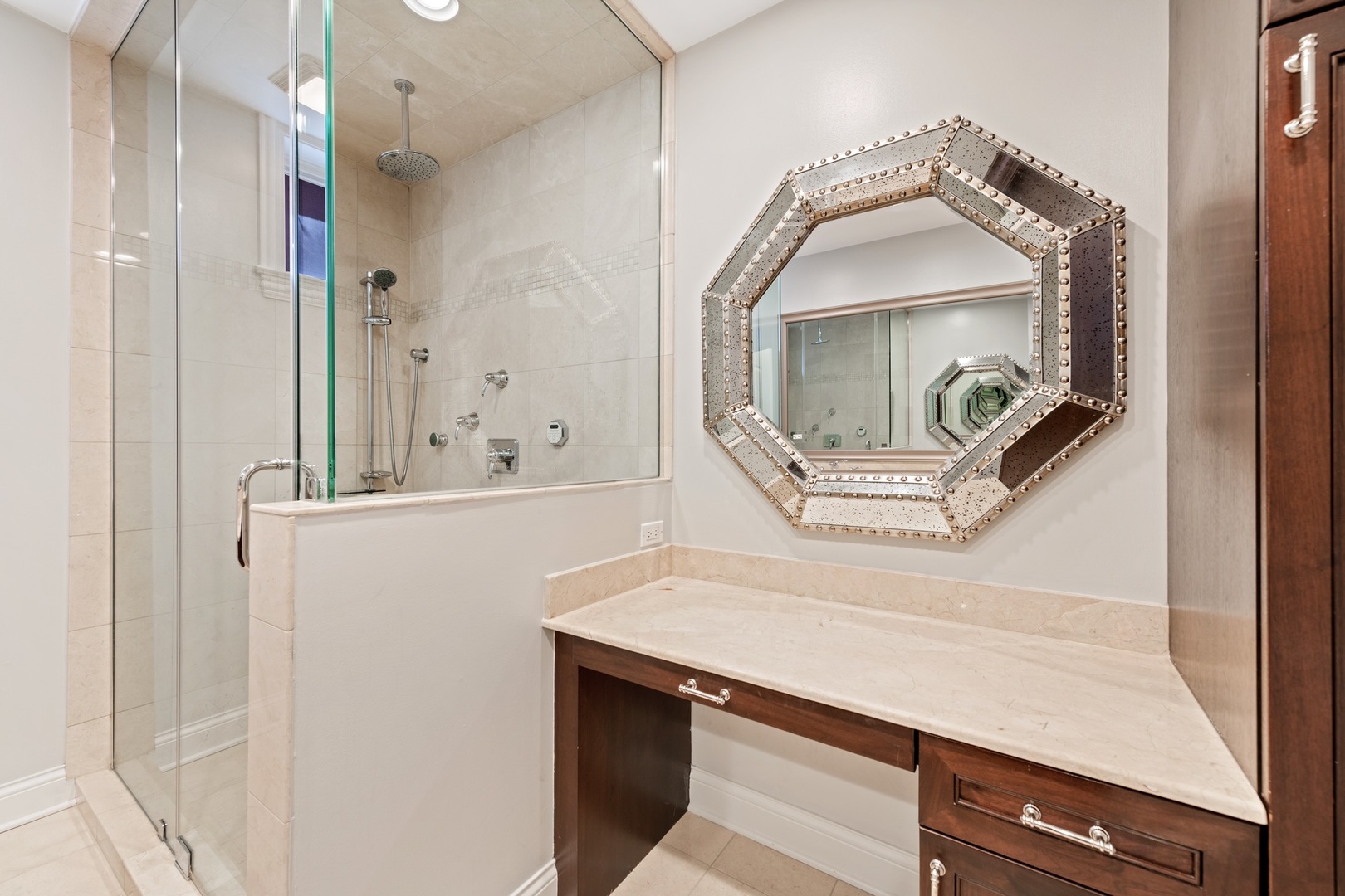 2620 North Racine Avenue, Unit 2S Chicago, IL 60614 - Photo 13 of 14 a bathroom with a sink a mirror a vanity and shower