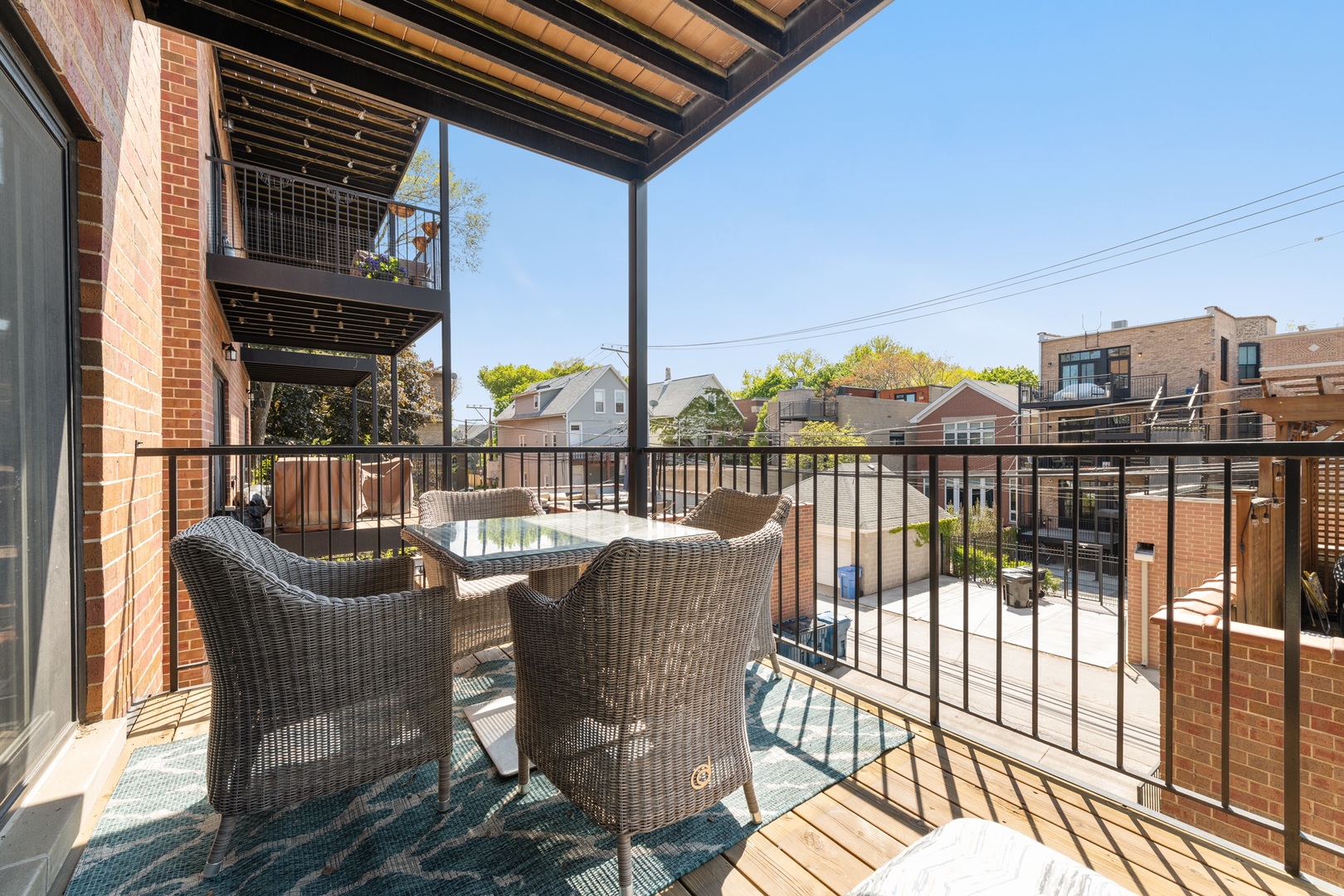 2620 North Racine Avenue, Unit 2S Chicago, IL 60614 - Photo 14 of 14 a view of a balcony with two chairs and a potted plant