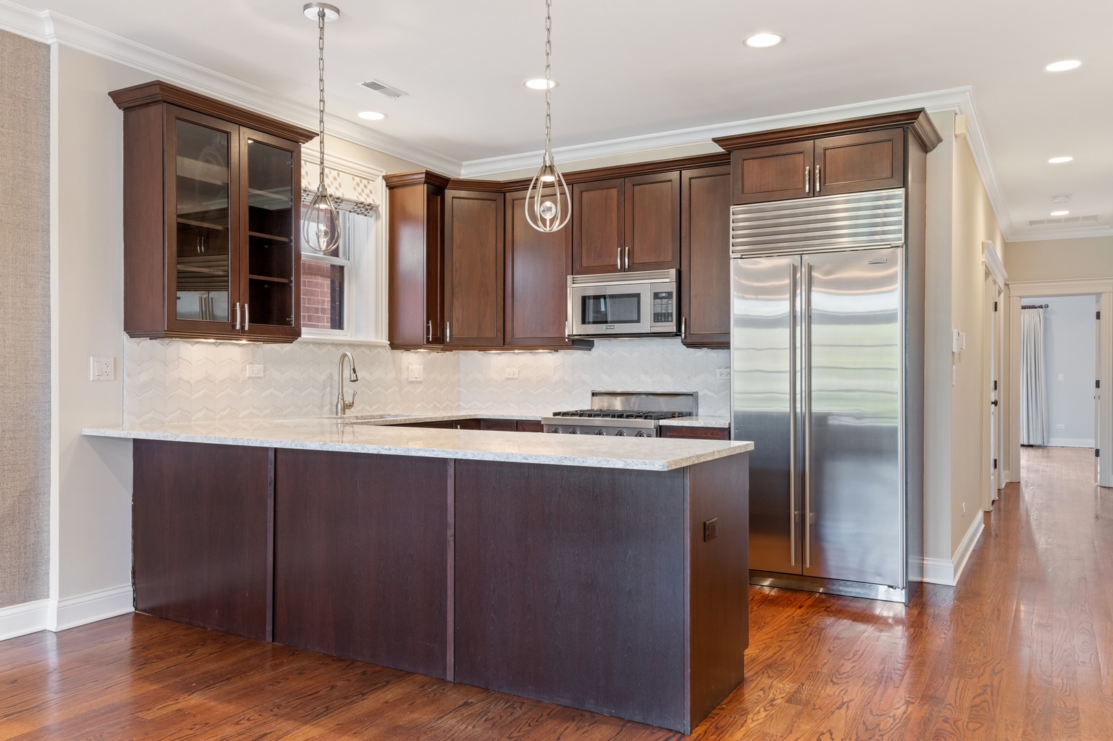 2620 North Racine Avenue, Unit 2S Chicago, IL 60614 - Photo 6 of 14 a kitchen with stainless steel appliances granite countertop a refrigerator a sink and a stove
