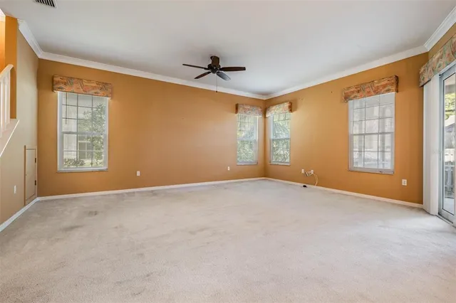 an aerial view of a house with a ocean