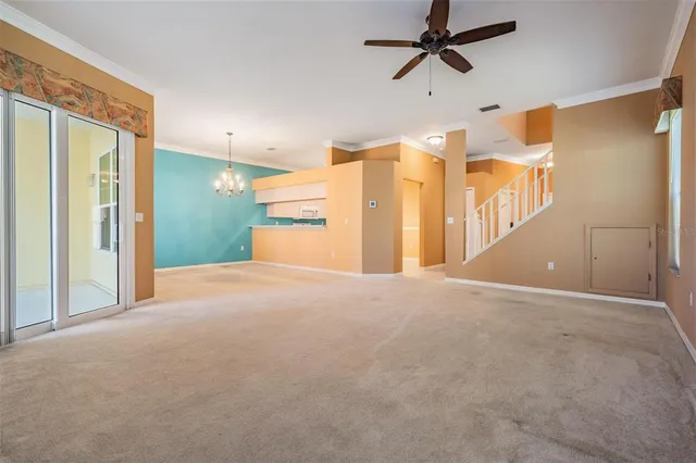 a view of staircase with railing and white walls