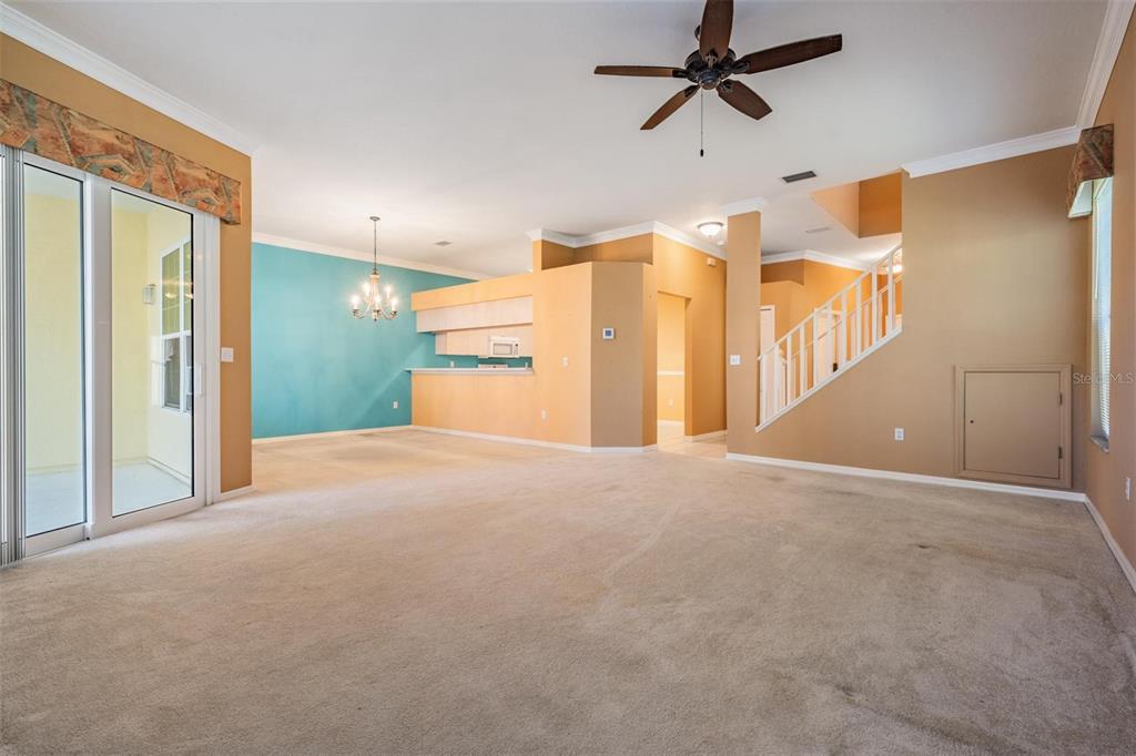 3494 Primrose Way Palm Harbor, FL 34683 - Photo 22 of 68 a view of a big room with a chandelier fan and windows