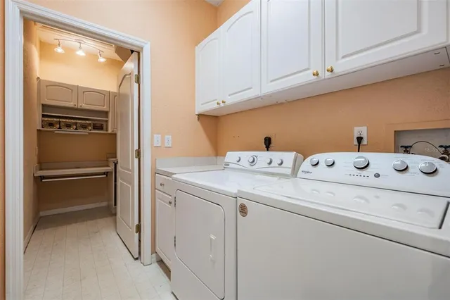 a view of storage and utility room with racks on the wall