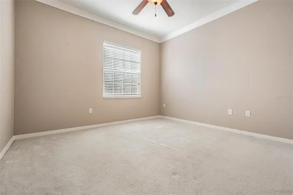 a white bath tub sitting next to a shower