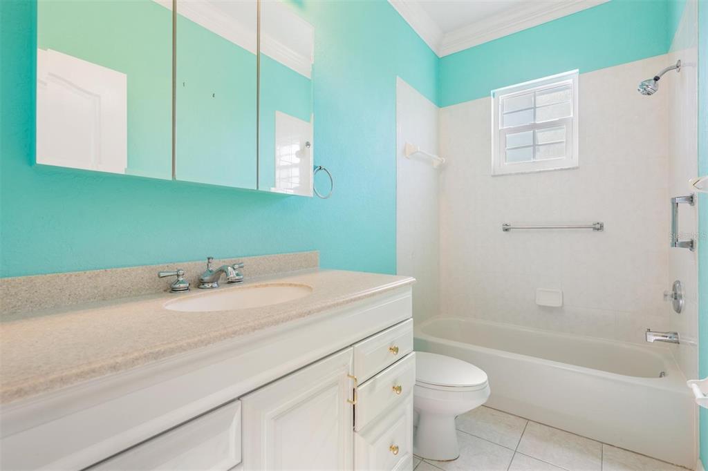 3494 Primrose Way Palm Harbor, FL 34683 - Photo 38 of 68 a bathroom with a sink a toilet and bathtub