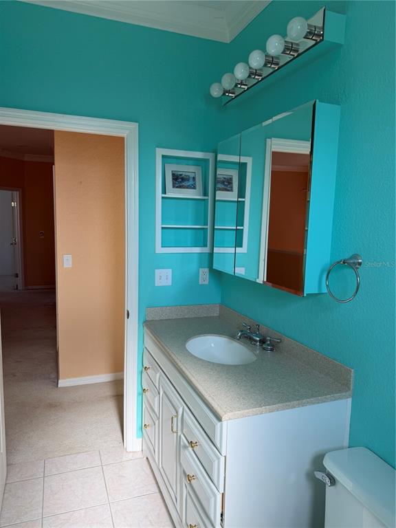 3494 Primrose Way Palm Harbor, FL 34683 - Photo 39 of 68 a bathroom with a sink and a mirror